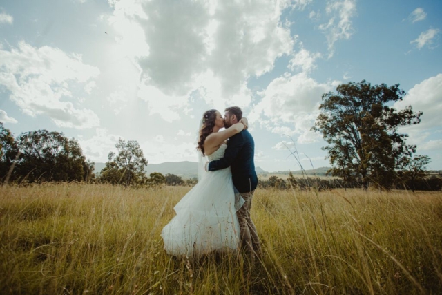 wedding couple in field