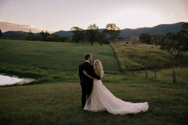 couple in field wedding