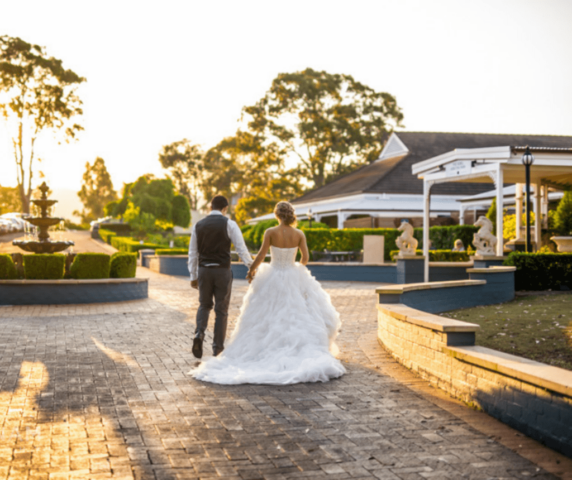 bride and groom outside sunset fountain