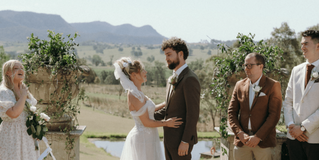 Couple saying I do overlooking the majestic backdrop in the Hunter Valley