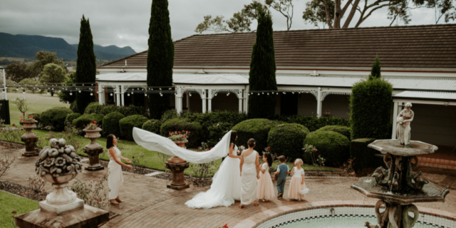 The beautiful bride with her flower girls