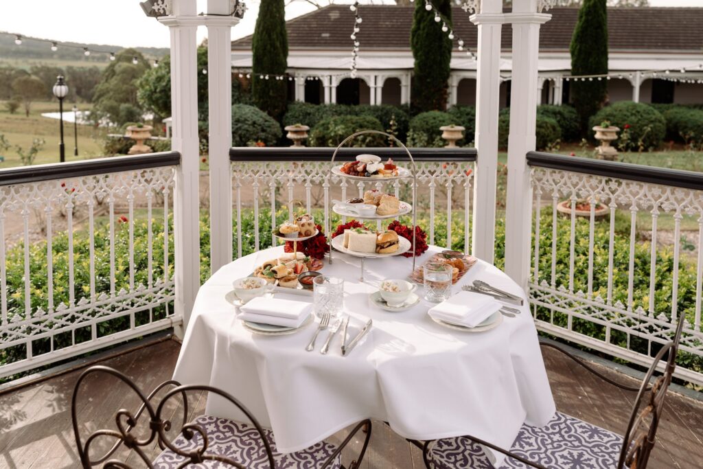High tea set for two in a garden alcove at voco Kirkton Park