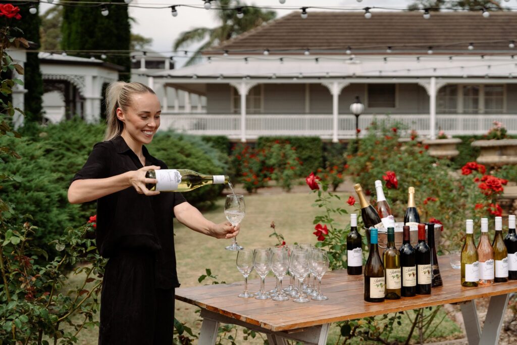 Local wine tasting at a pop-up cellar door in the rose garden at voco Kirkton Park